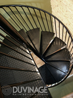 Duvinage Custom Spiral Stair in Diamond Plate Steel with Helixed Steel Handrail and Rod Balusters